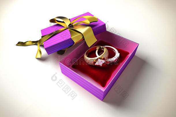 打开一个金色丝带礼盒，两个珍贵的戒指。