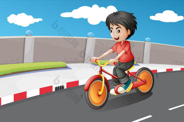 骑着橙色轮子的自行车的男孩