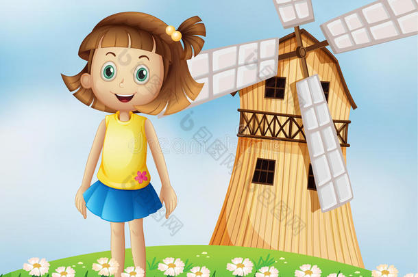 山顶上开着风车的小女孩