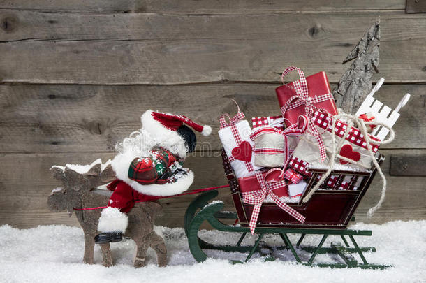 圣诞卡装饰：麋鹿拉圣诞雪橇的礼物
