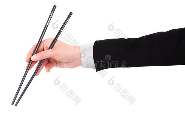 商人的手拿着筷子