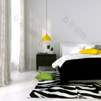 黑白相间的床和一盏黄灯图片