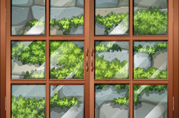 一扇可以看到植物和石墙的窗户