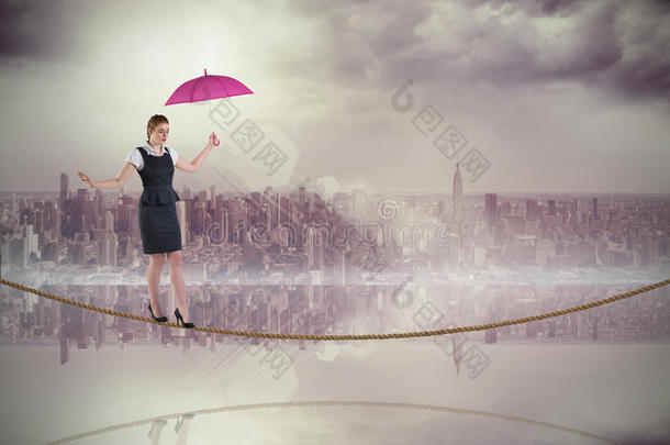 <strong>美女</strong>红发女商人在钢丝绳上<strong>撑伞</strong>的合成图片