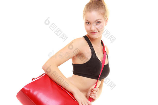 运动。穿着运动装的健身运动女孩，带着运动包