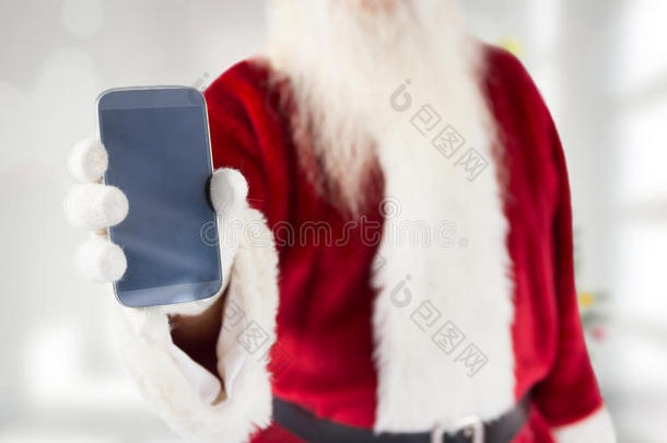 圣诞老人展示智能手机的合成图片