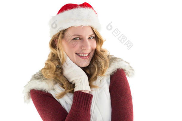 喜庆的金发女郎戴着圣诞帽微笑