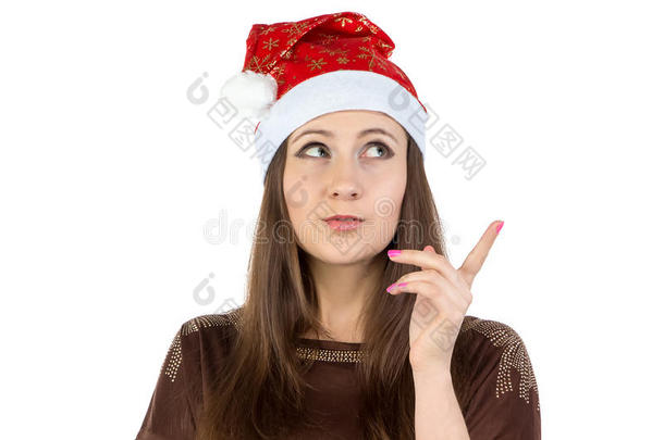 戴圣诞帽思考的年轻女子照片