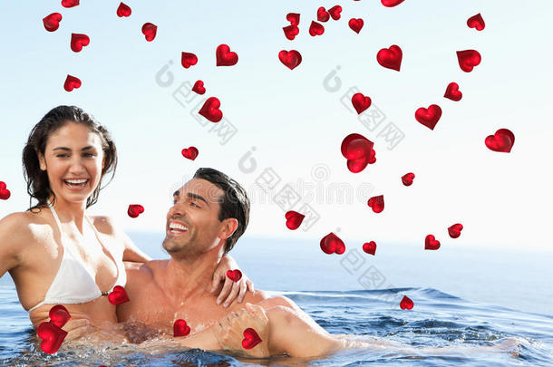 夫妻在游泳池里一起享受时光的复合图像