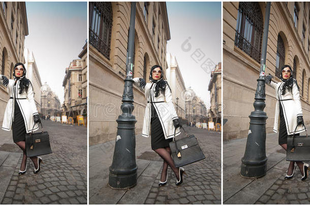 迷人的年轻女子在冬季时尚拍摄。 美丽时尚的年轻女孩穿着黑白服装在大街上摆姿势
