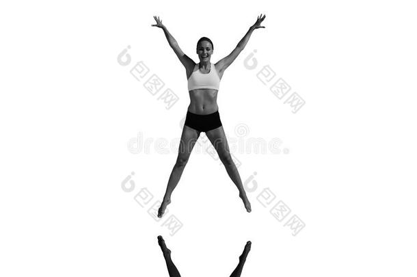 适合的女人用手臂跳出来的复合图像