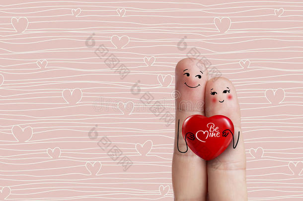 概念手指艺术。 恋人们拥抱着红色的心。 股票