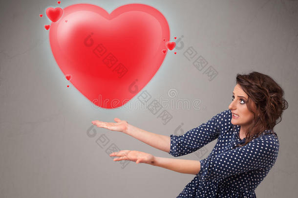 年轻女士抱着可爱的3d红心