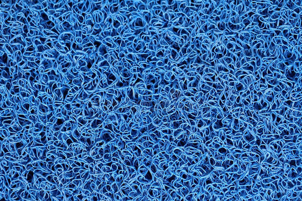 蓝色<strong>地毯</strong>或脚刮板或门垫的抽象背景。