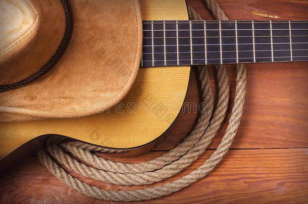 乡村音乐图片与吉他，牛仔帽和绳子