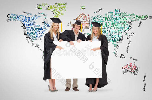 三名学生穿着研究生长袍拿着并指向一个空白标志的复合图像