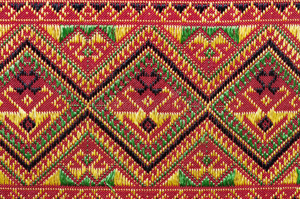 五颜六色的泰国丝绸手工艺品秘鲁风格的地毯表面关闭更多的这个主题和更多的纺织品秘鲁条纹美丽的背景