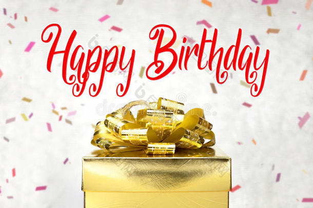 特写金色礼品盒，生日快乐字样和五彩纸屑模糊背景