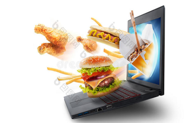 从笔记本电脑屏幕上飞出的食物