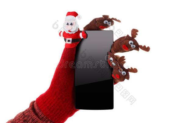 圣诞概念玩具圣诞老人和驯鹿手中的智能手机礼物