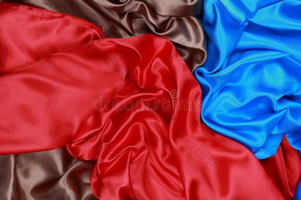 <strong>蓝色</strong>、棕色和红色的波浪褶皱<strong>绸缎</strong>布