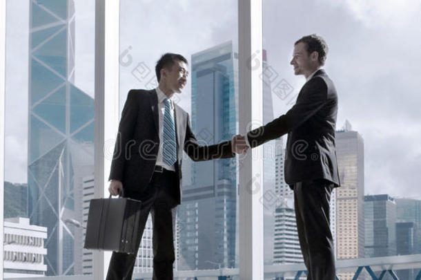 亚洲商业握手协议伙伴关系概念