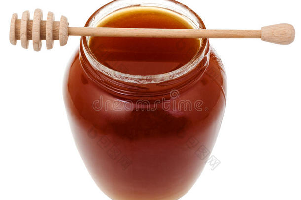 带<strong>棕色</strong>蜂蜜和木棒的<strong>玻璃瓶</strong>