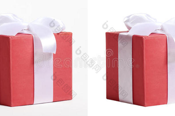 礼品盒装饰丝红丝带和蝴蝶结，对象在白色工作室背景