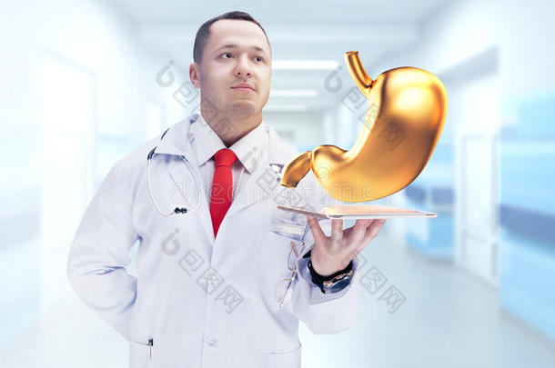 医生在药片上拿着金色的人体器官。 高分辨率。