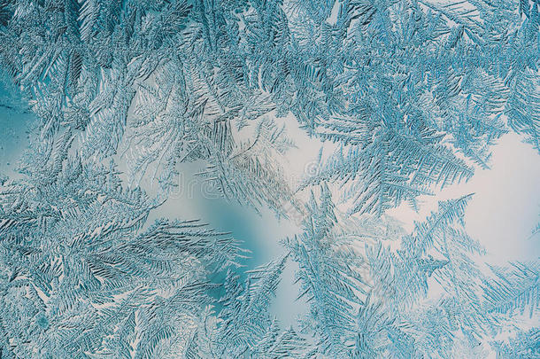 美丽的特写冬季五颜六色的背景与冰霜图案