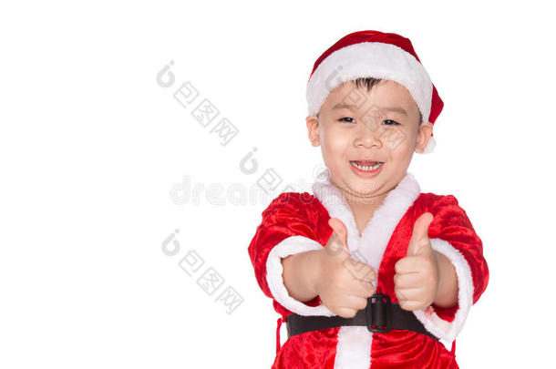 圣诞节时间-带圣诞老人帽子的男孩。 小男孩像圣诞老人