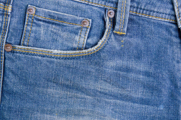蓝色牛仔牛仔裤的质地。 蓝色牛仔裤织物纹理。 牛仔裤背景。