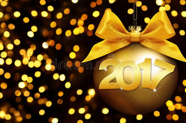 圣诞球和2017年的文字与金色丝带蝴蝶结在蓝色