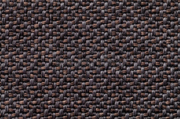 黑色和棕色复古织物与编织纹理特写。 纺织宏观背景