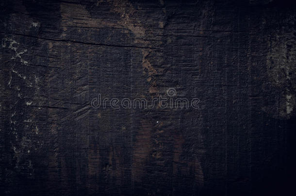 黑色深色木材背景，木板粗糙颗粒表面