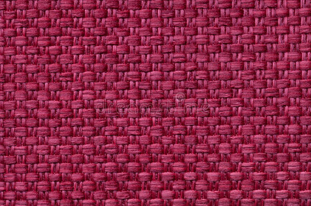 暗红色纺织品背景与格子图案，特写。 织物宏观结构。