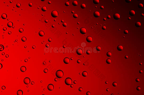 背景从不同大小的滴在红色玻璃上