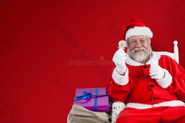 圣诞老人拿着牛奶和饼干的合成图像
