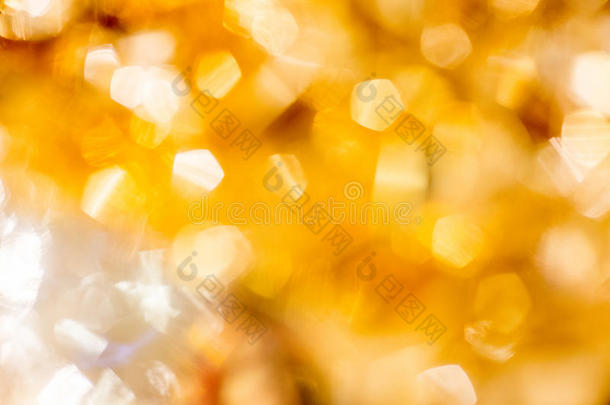 金色圣诞波克背景。 黄金假期发光抽象闪光散焦