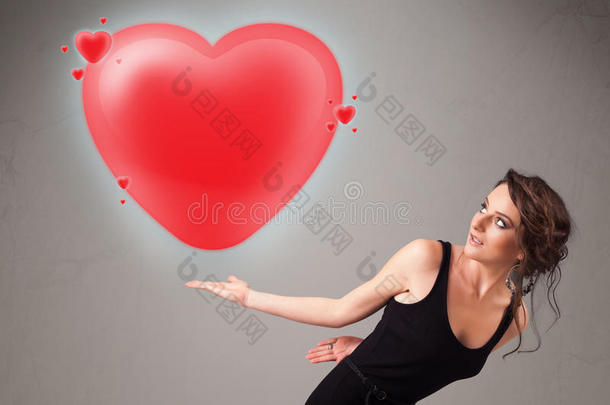 年轻女士抱着可爱的3d红心