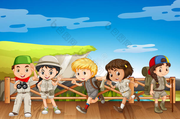 五个穿着狩猎服装的孩子在桥上
