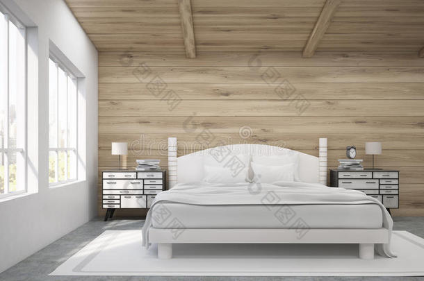 有木墙和天花板的房间里双人床的正面视图。
