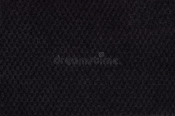 黑色背景来自柔软的蓬松织物特写。 纺织品宏观纹理