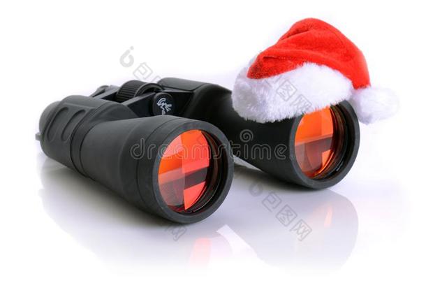 圣诞节在望远镜上搜索圣诞老人帽子
