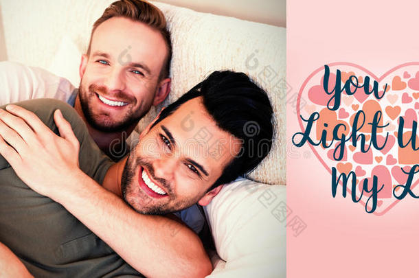 男人在床上和情人节单词的复合图像