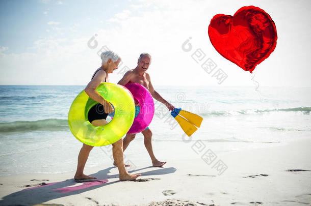 老年夫妇在海滩和红心气球3D上的复合图像