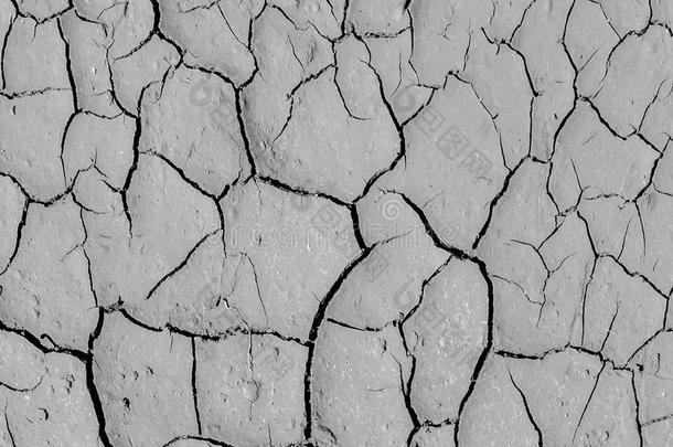 单调灰色土壤地板背景纹理的农村天然裂缝地面抽象图案线