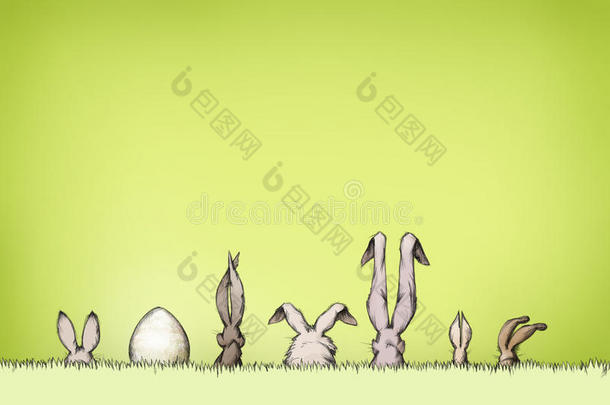 绿色草地上有复活节彩蛋的复活节兔子
