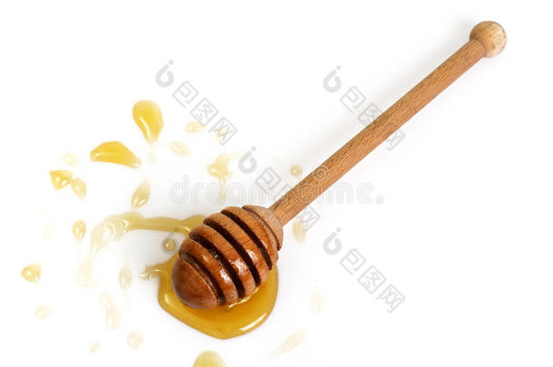 新鲜芬芳的蜂蜜放在碗里，在白色的背景上吃晚饭