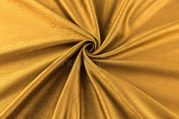 金色背景豪华布或波浪褶皱的丝纹理缎子